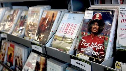 Photo of a shelf of DVDs at the library.