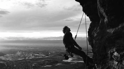 Photo courtesy of Enzo Fantone of a figure abseiling.