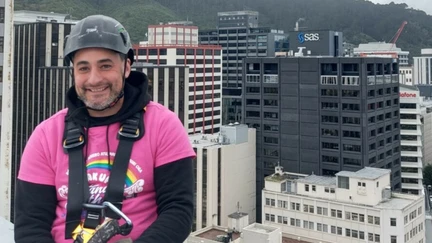 Anaru Kerei, director of Wellington Abseiling Maintenance, at work on a city building. Photo courtesy of WAM.