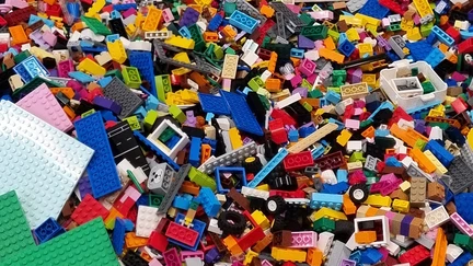 A huge pile of LEGO pieces of various shapes, sizes and colours.