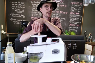 Photo of Tim Key, a musician and self-described Fizz Whizz making his beverage.