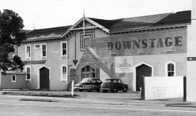 Black and white photograph of the wooden Star Boating Club building with "Downstage" painted on the front