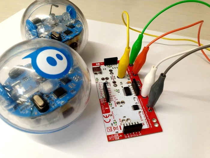 Two Spheros (spherical robots with transparent external panelling so you can see