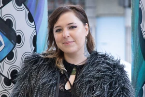 Izzy Te Aho White, a young Māori woman, smiling