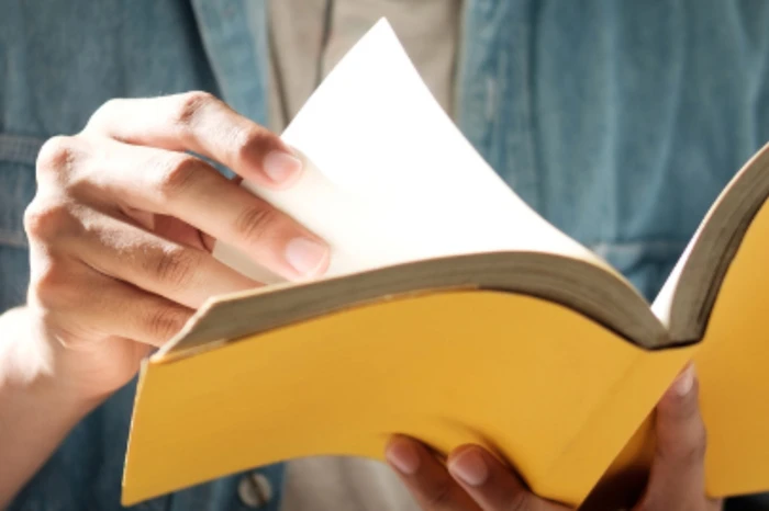 Photo of a person reading.