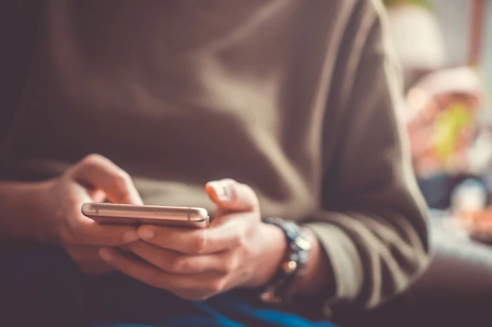 Person using a mobile phone to get in touch