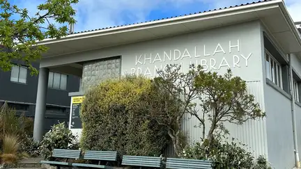 Exterior of Khandallah Library, with outside benches in front and steps to the entrance