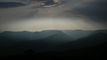 Atmospheric sky above some silhouetted Aotearoa hills