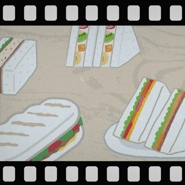 A film negative style border around an image of a tray of sandwiches