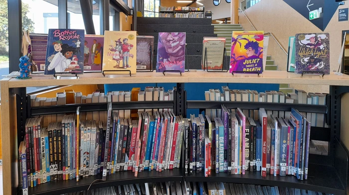 Library shelving displaying comic books