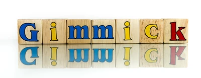 The word gimmick, written with colourful alphabet blocks