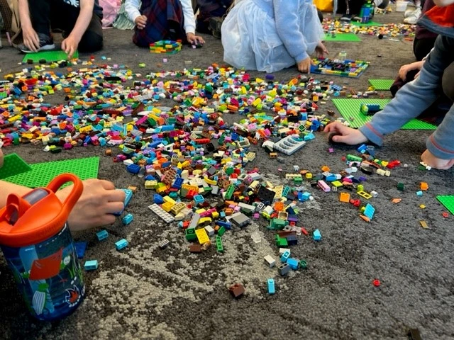 A huge pile of LEGO pieces of various shapes, sizes and colours.