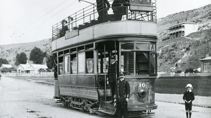 A black and white photo of a tram